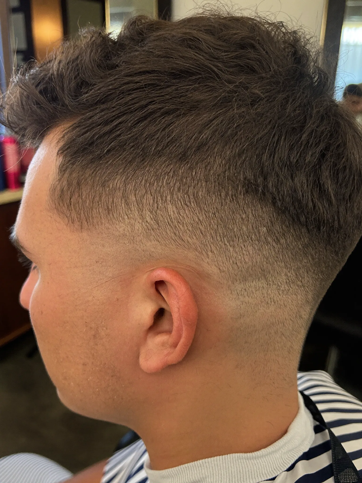 Mid fade with a hard part